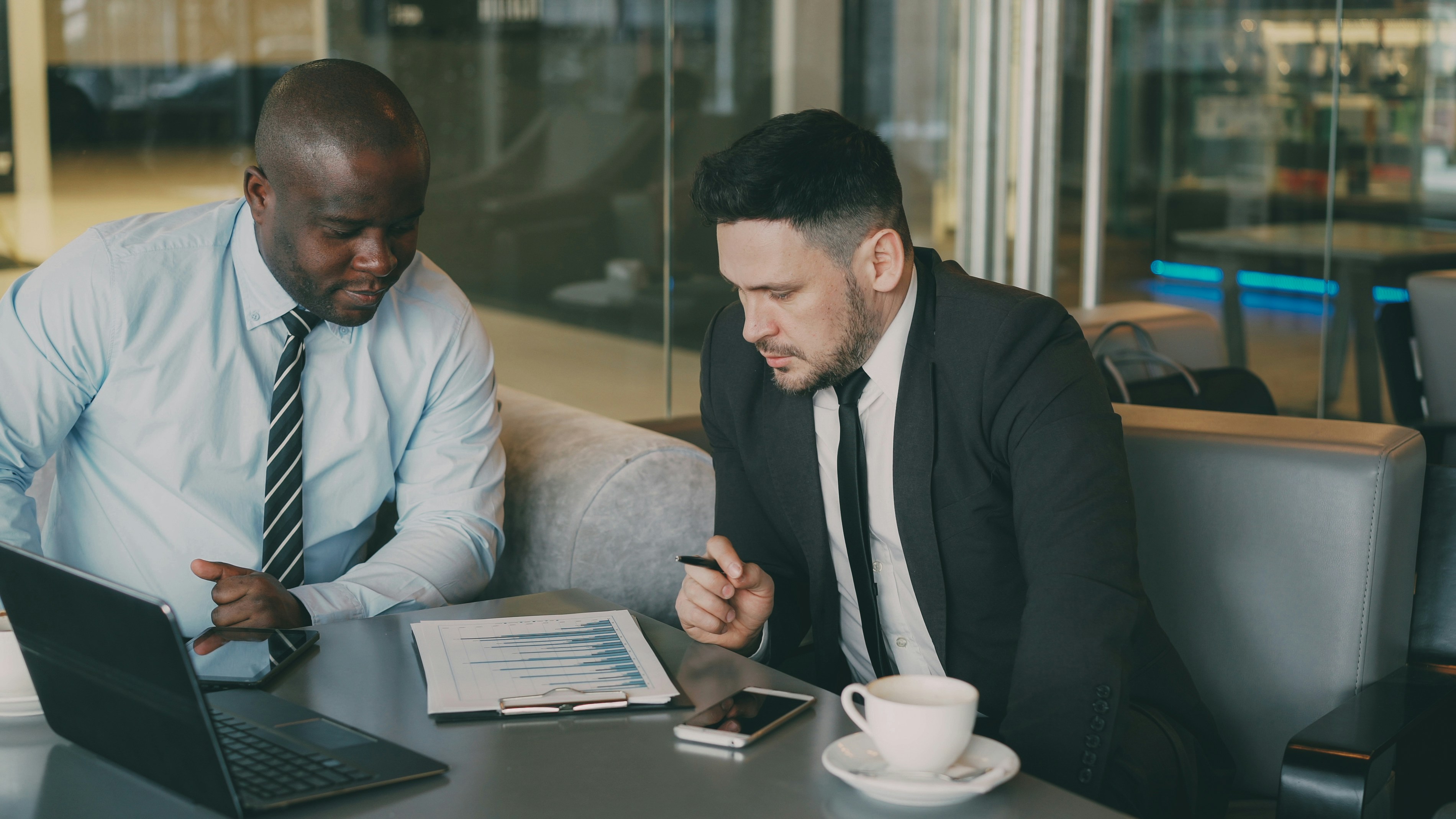 Strategic partners reviewing growth data during a business meeting